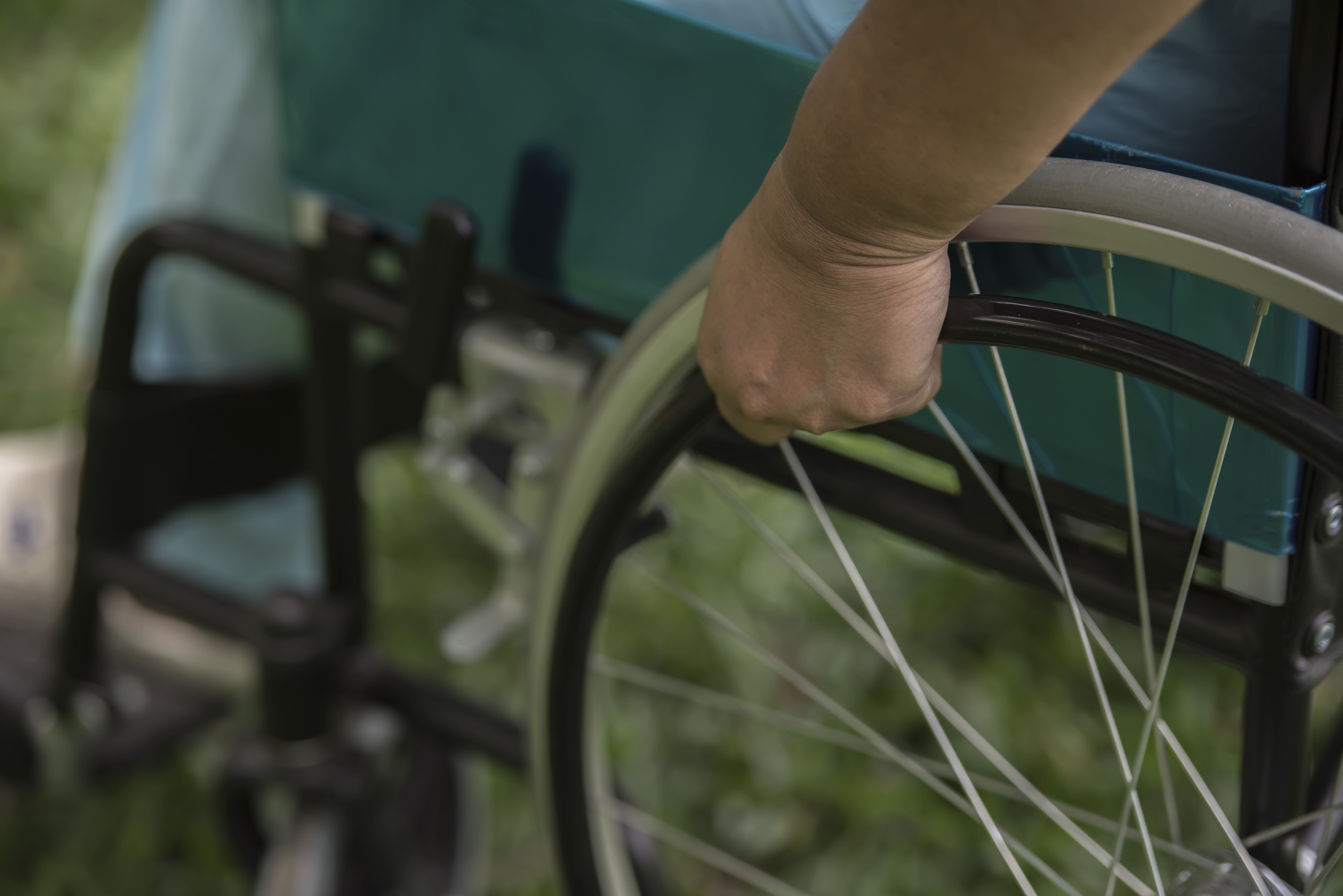 close-up-lonely-elderly-woman-sitting-wheelchair-garden-hospital