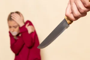 front-view-young-female-red-shirt-with-tied-mouth-scared-knife-cream-space-female-cloth-photo