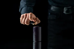 front-view-dark-candle-dark-surface