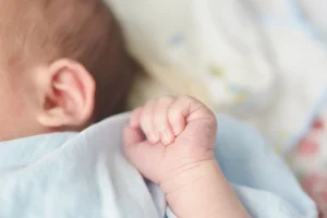 baby-hands-child-sucks-fists