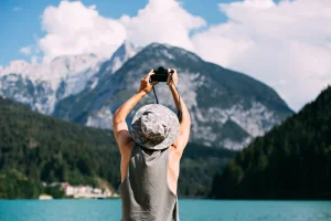 tourist-taking-photos-nature-landscape-using-his-smartphone