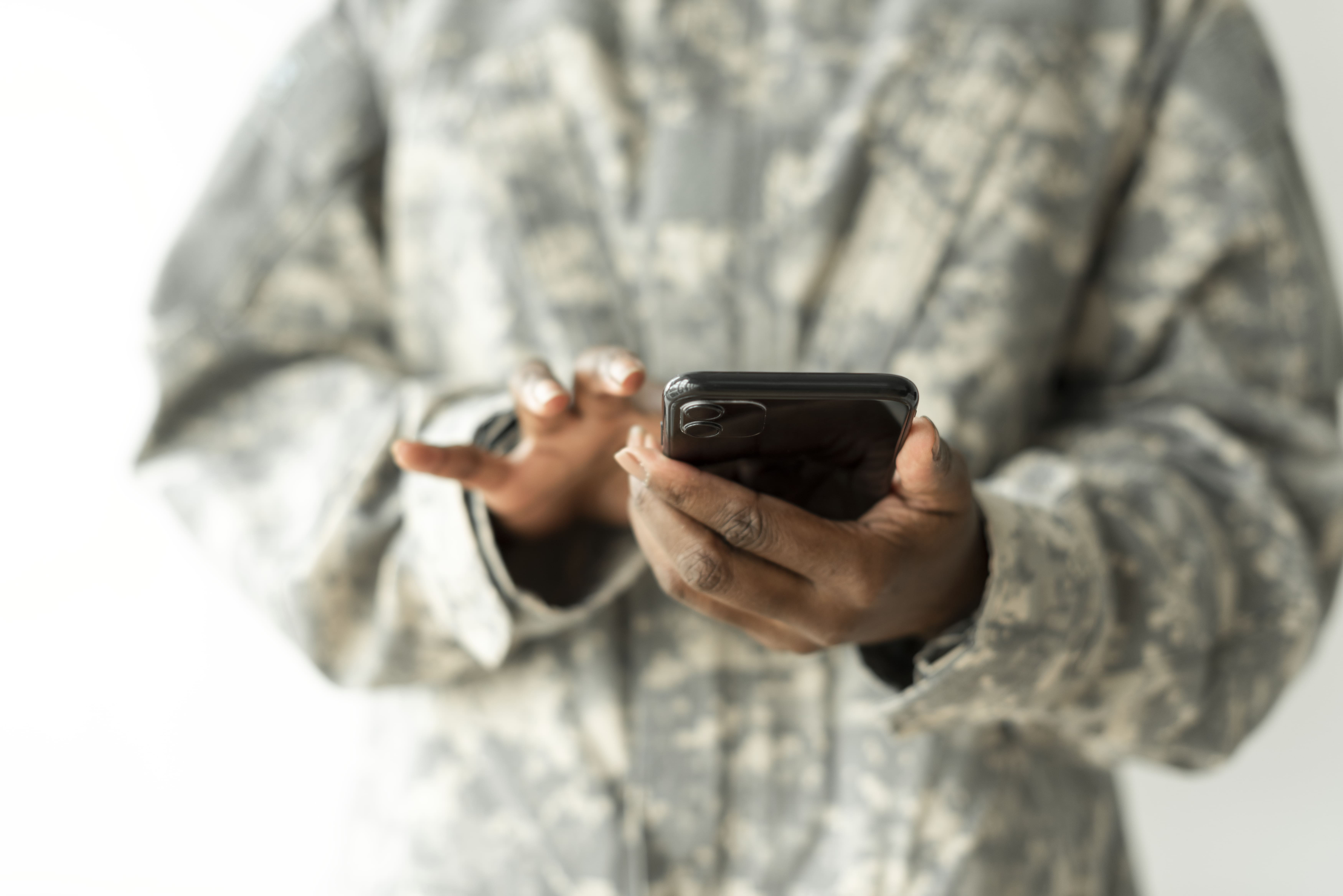 female-soldier-using-smartphone-communication-technology